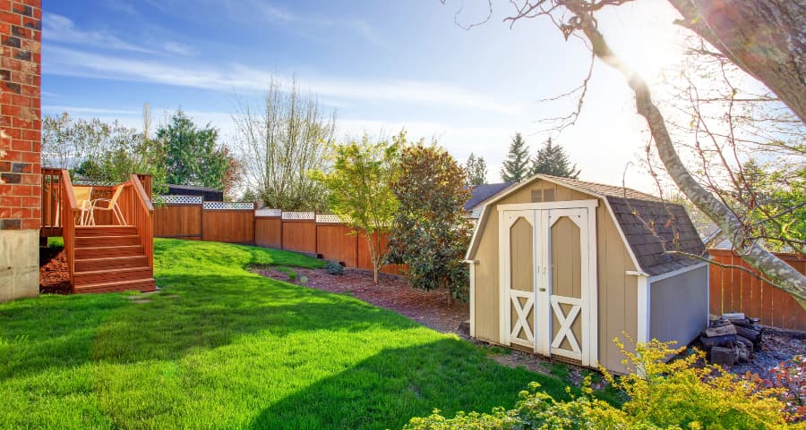 Fenced backyard with storage shed in Gulfport